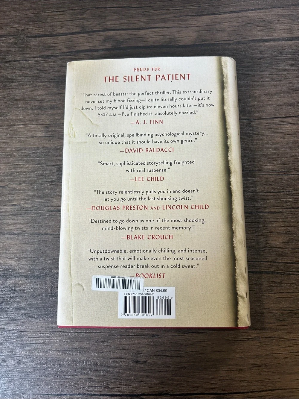 The Silent Patient by Alex Michaelides Hardcover Book - Cream with Red Text